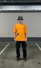 Load image into Gallery viewer, Orange Boxy Shirt with Black Prints
